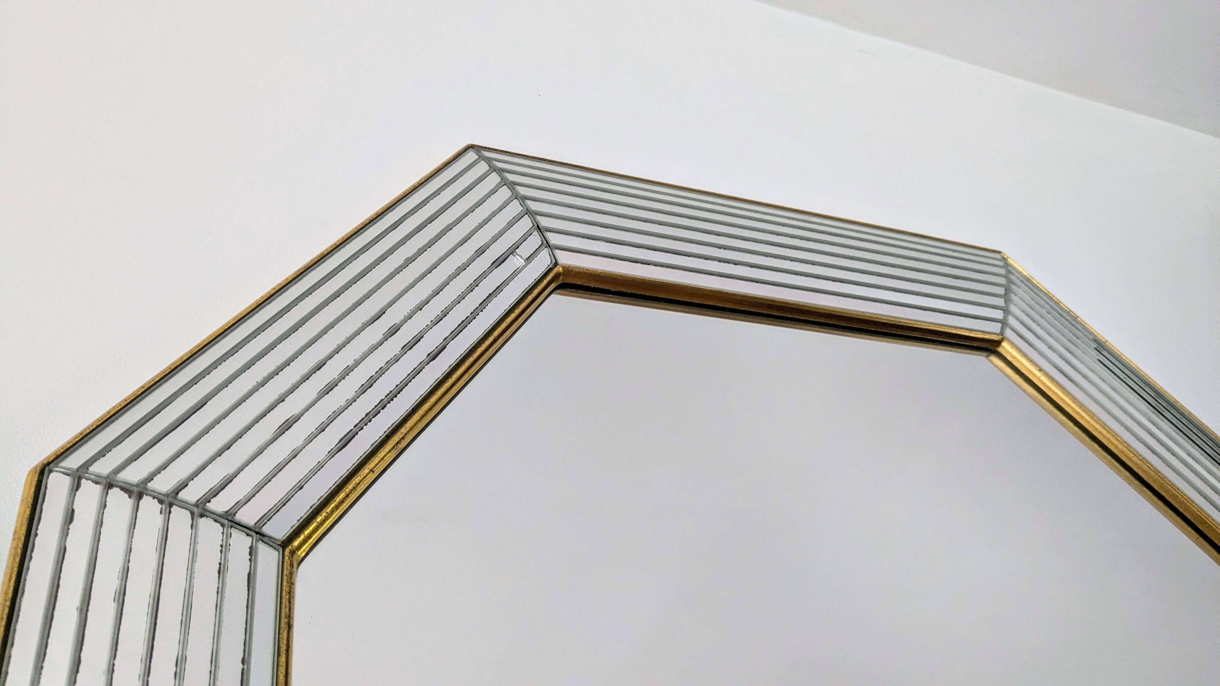 Octagonal mirror with brass parcloses by Jan Deknudt