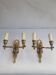 Pair of wall sconces candle holders in Empire style in bronze