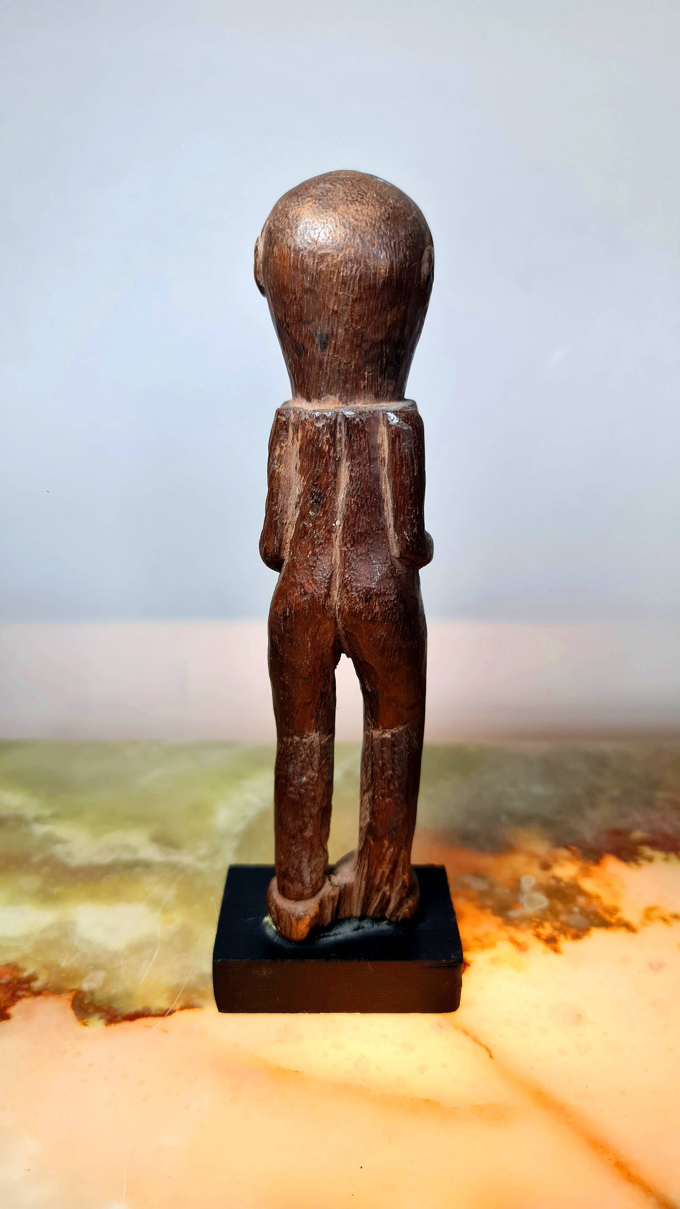 Old Fon statuette on a base, Benin