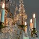 Bronze cage chandelier adorned with molded glass pendants in the shape of peacock feathers, circa 1800