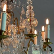 Bronze cage chandelier adorned with molded glass pendants in the shape of peacock feathers, circa 1800