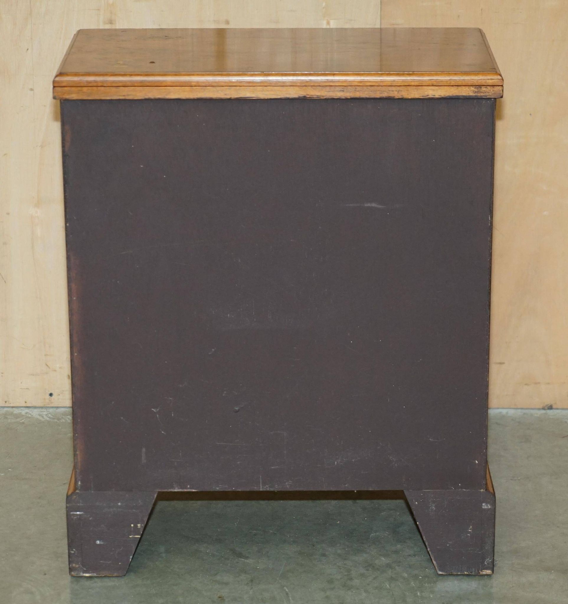Vintage walnut commode with sliding top in Butler style.