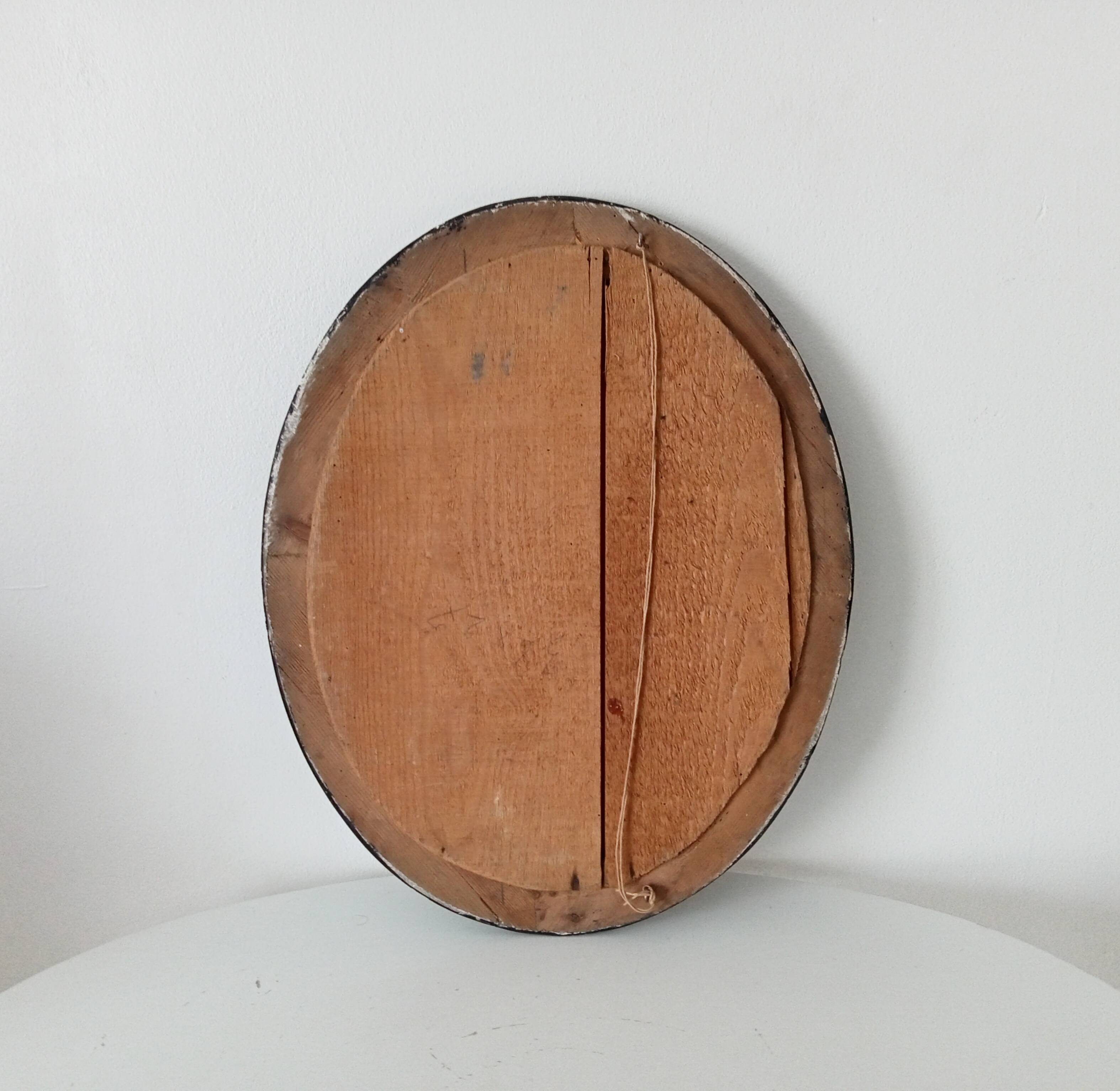 19th-century antique mirror in wood and stucco.