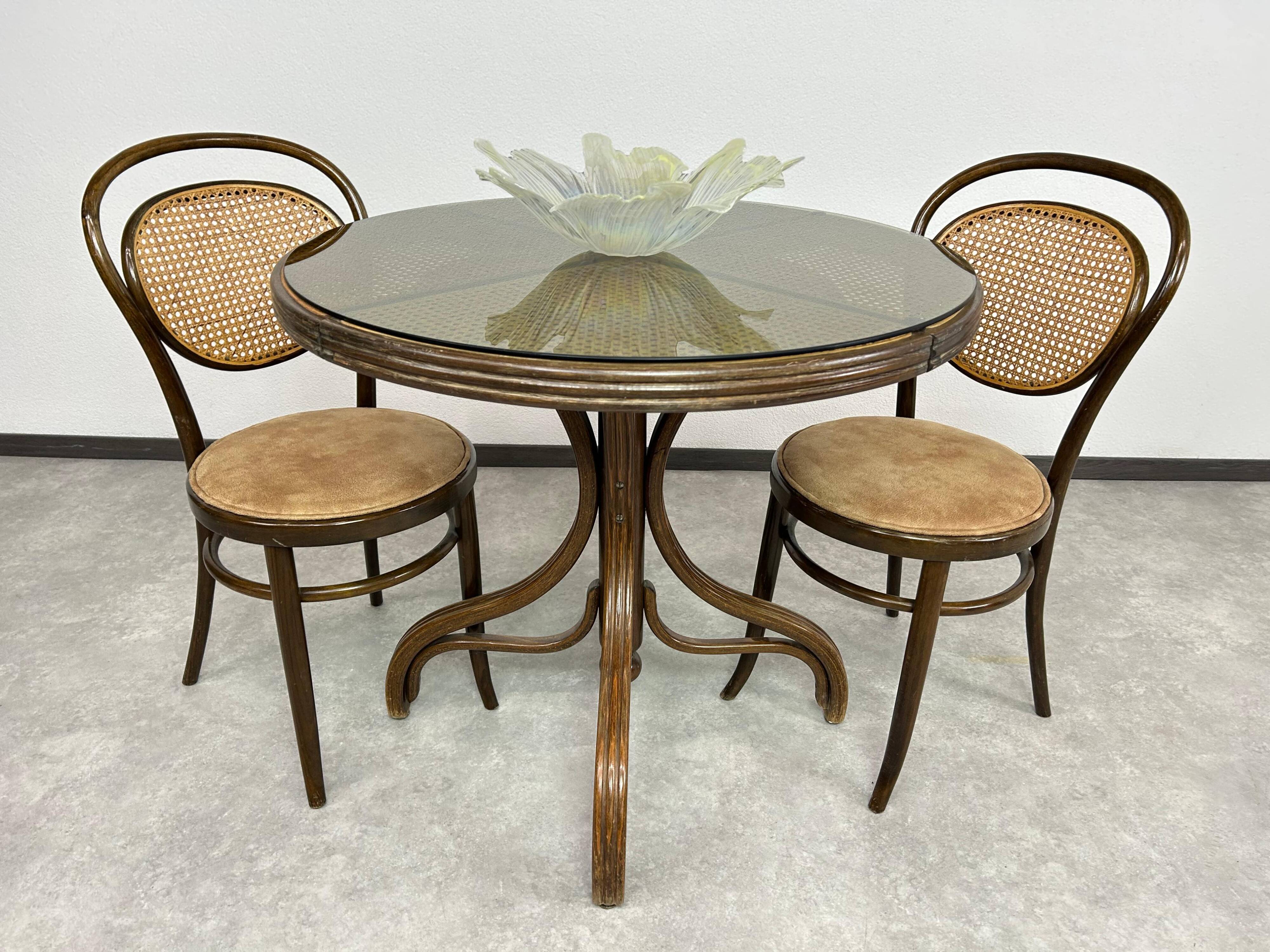 Thonet dining table for 4 people with a glass top.