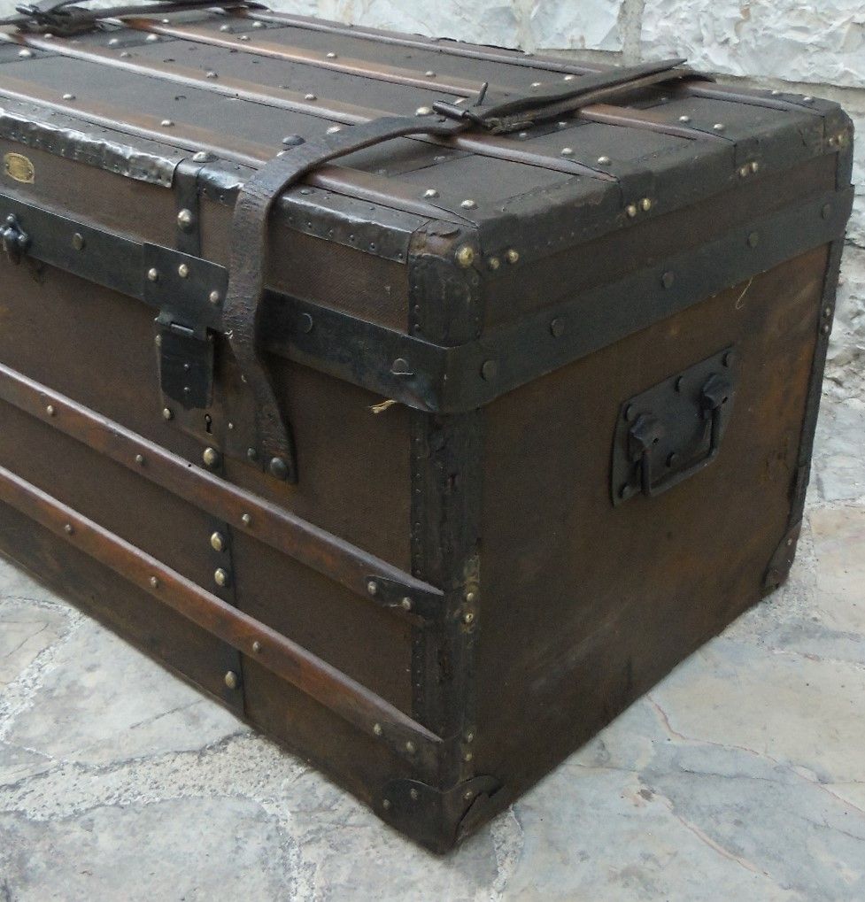 Old wooden and leather trunk, old brass nail trunk and leather strap