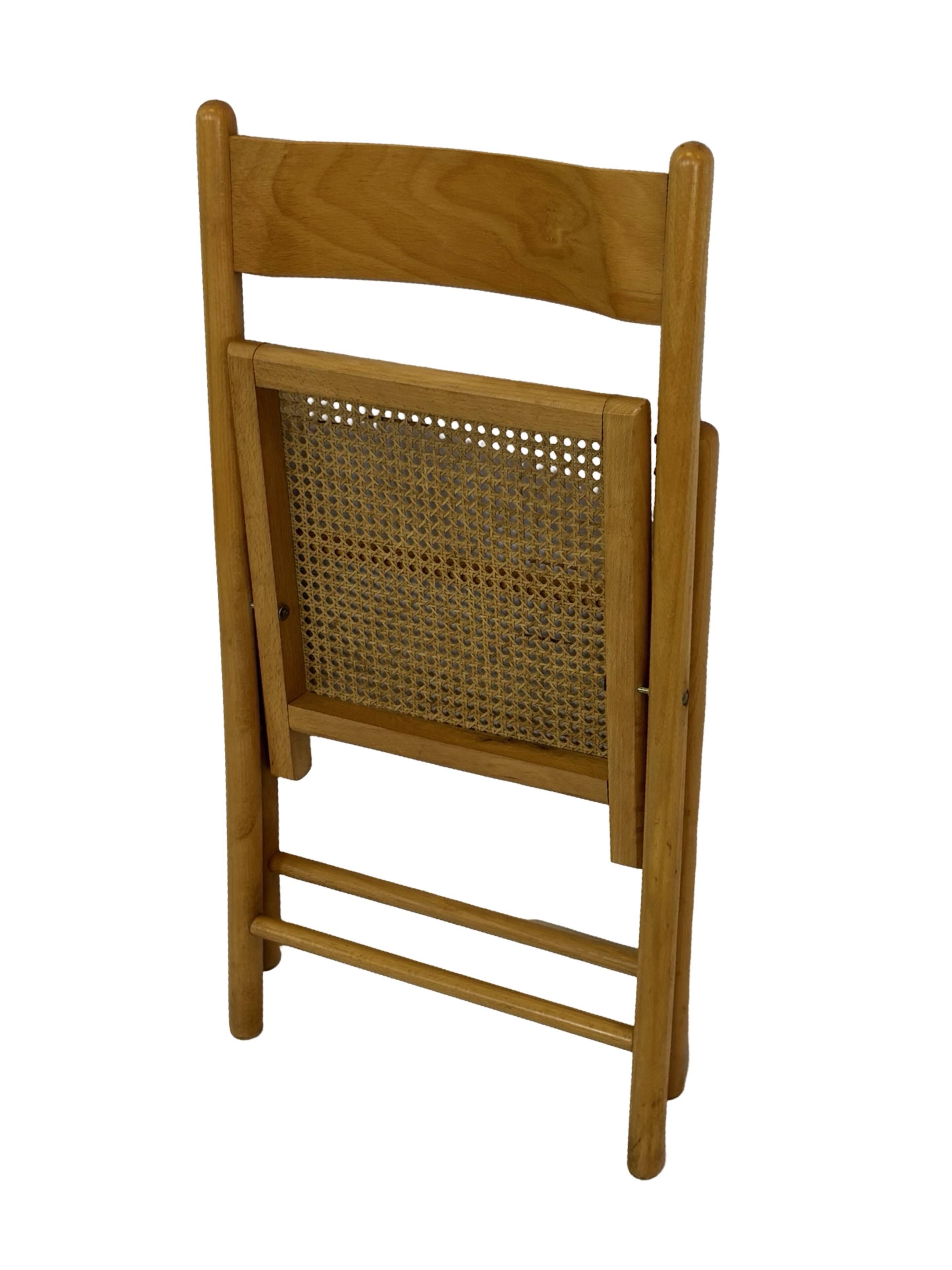 Vintage wooden folding chair with rattan seat 80s minimalist design