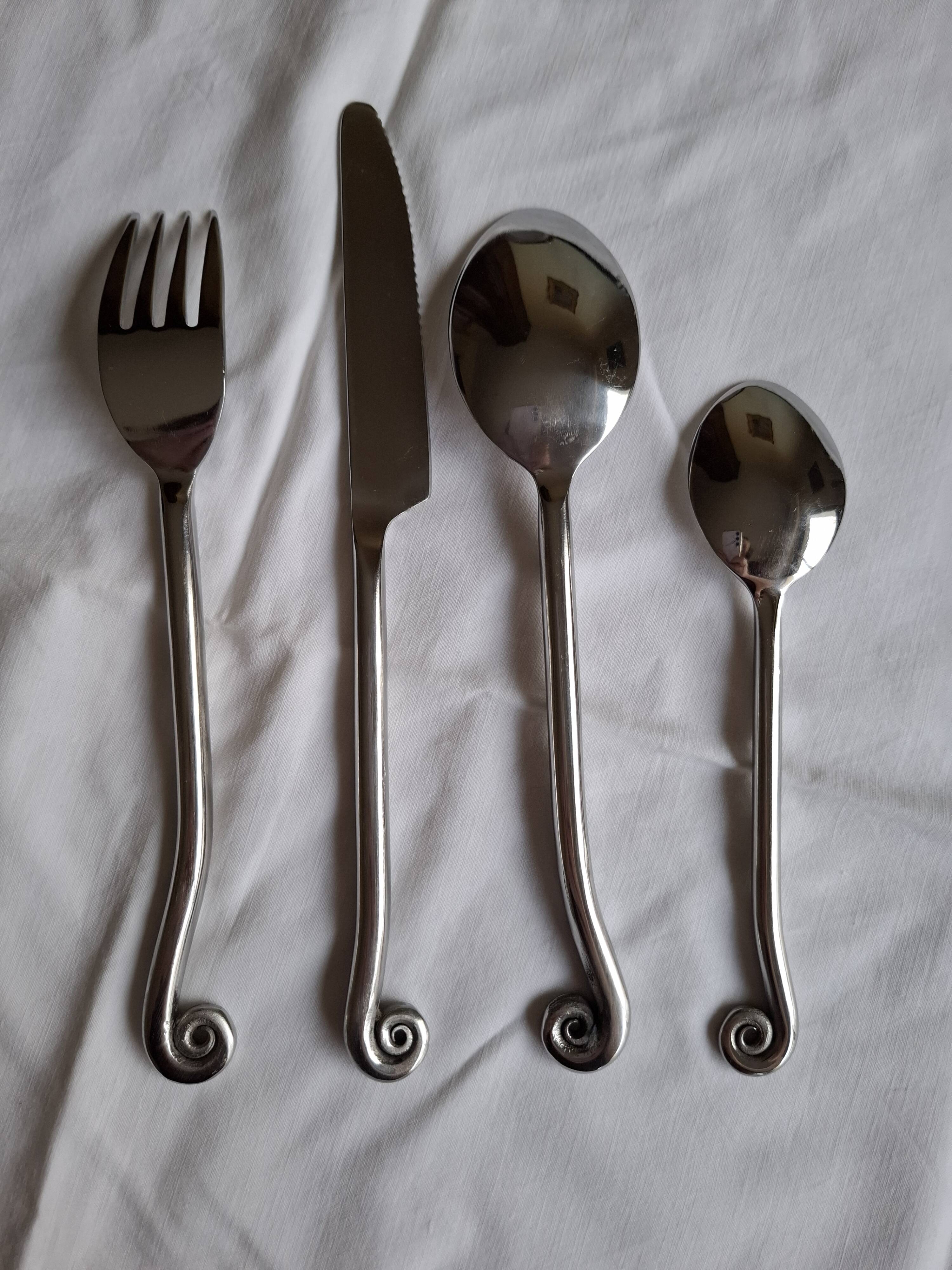 Twisted metal cutlery with a fancy spiral design.