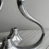 Pair of designer candlesticks in chromed metal