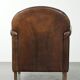 Armchair / lounge chair made of sheepskin leather with characterful patina