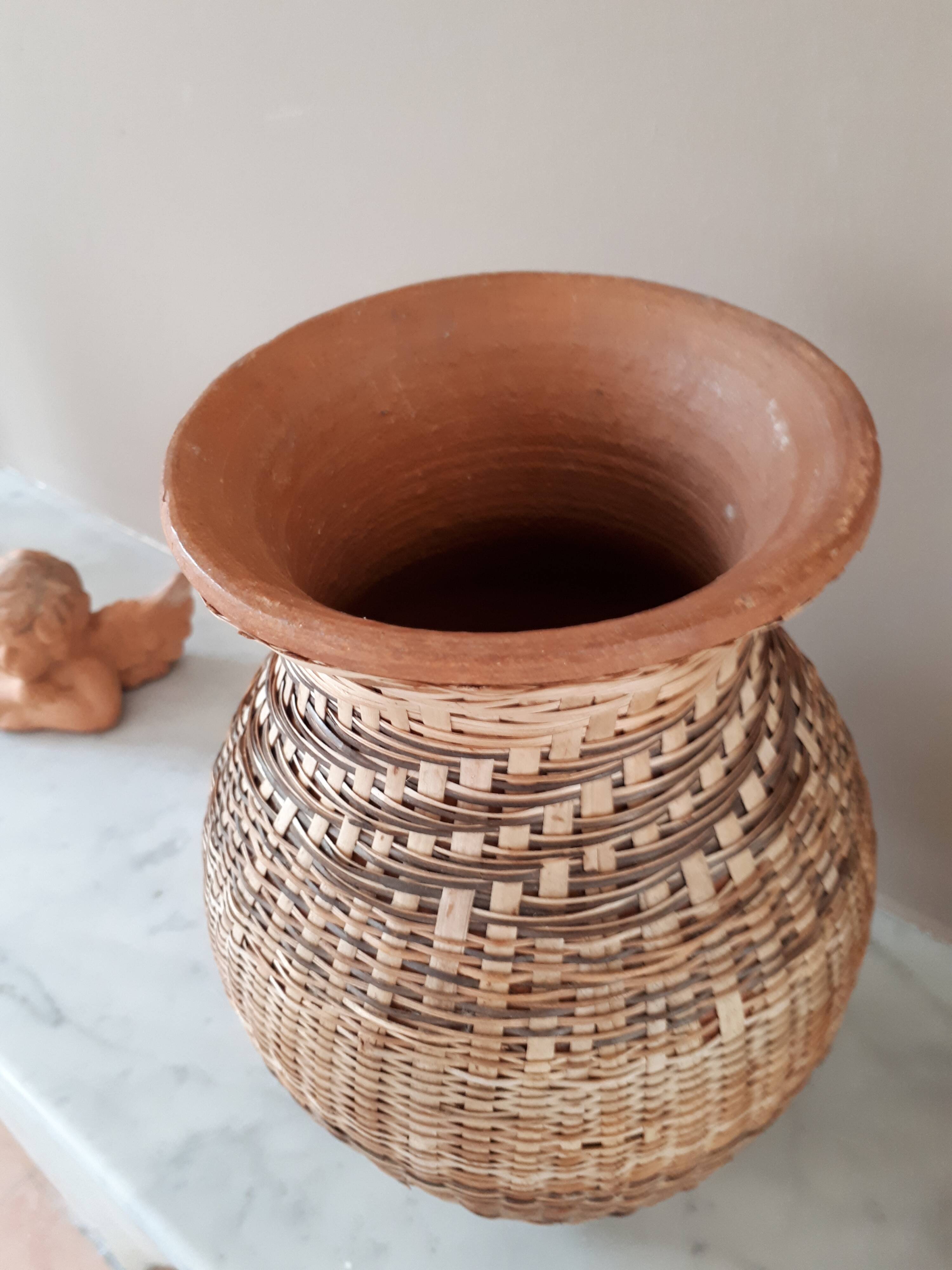 Vintage vase in sandstone and straw wicker