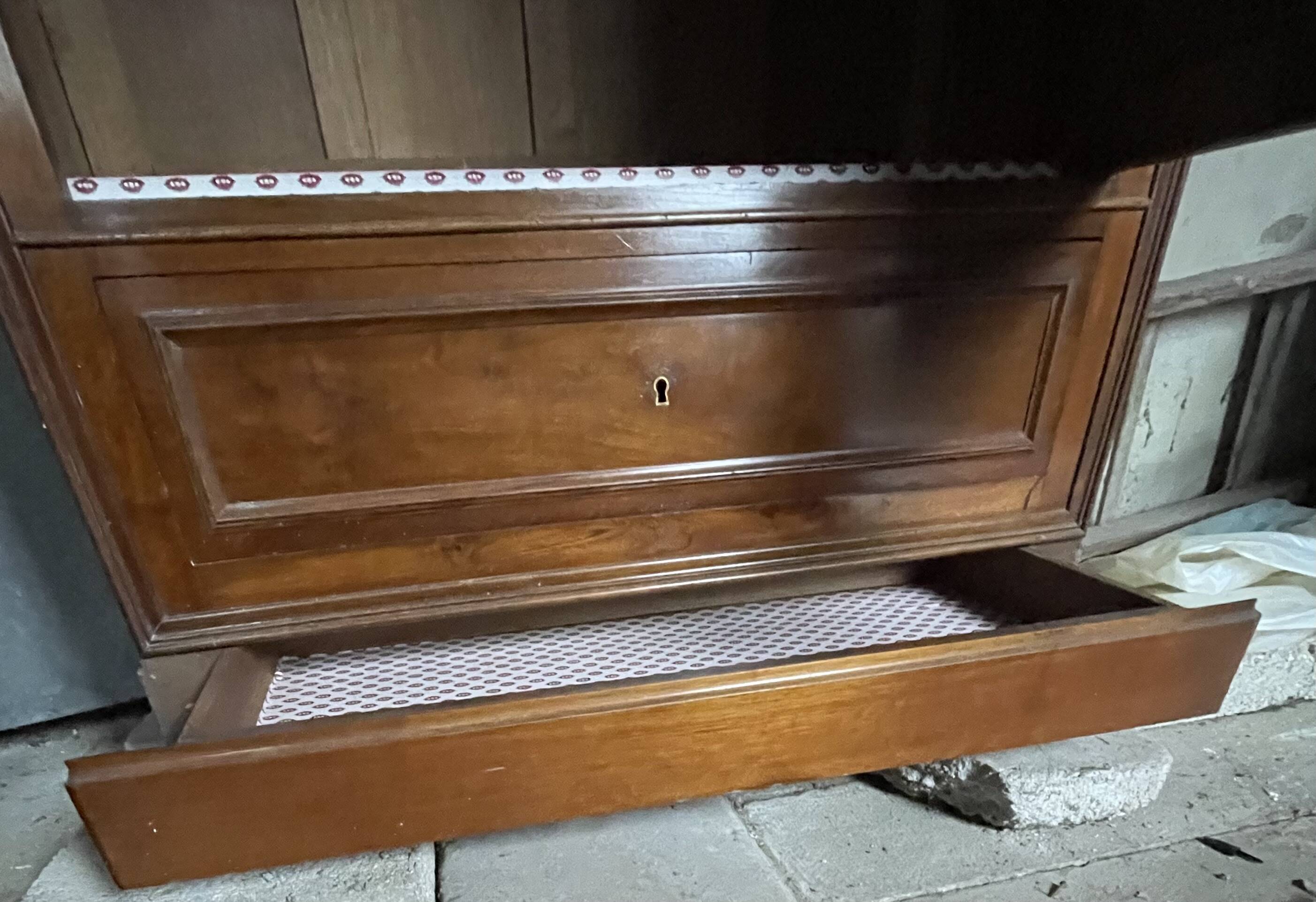 Antique wardrobe with a mirror door.
