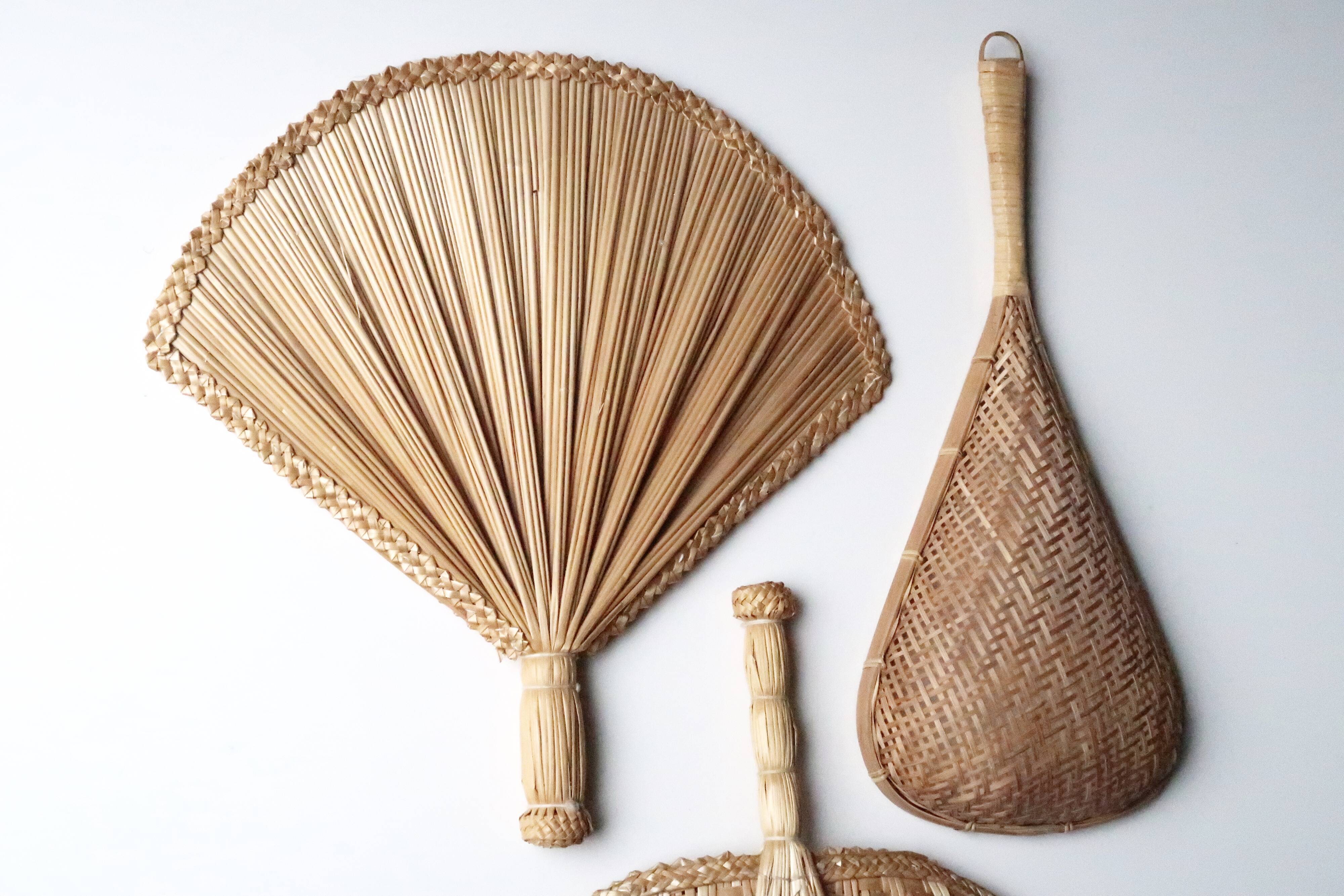 Trio of wall decorations in straw and wicker, 70s