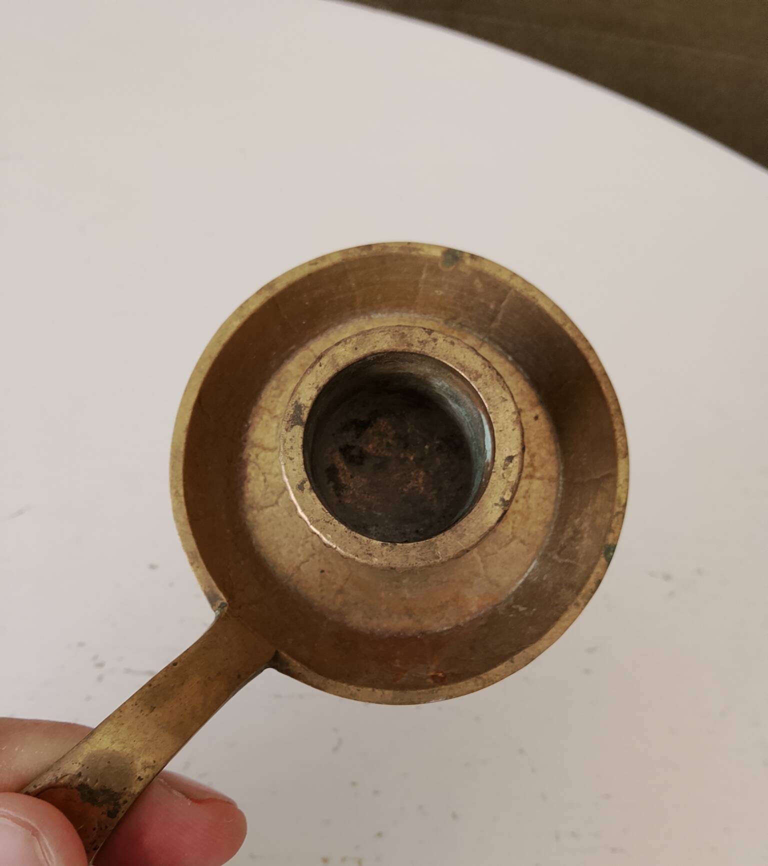 Antique hand-held candlestick in gilded bronze