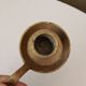 Antique hand-held candlestick in gilded bronze