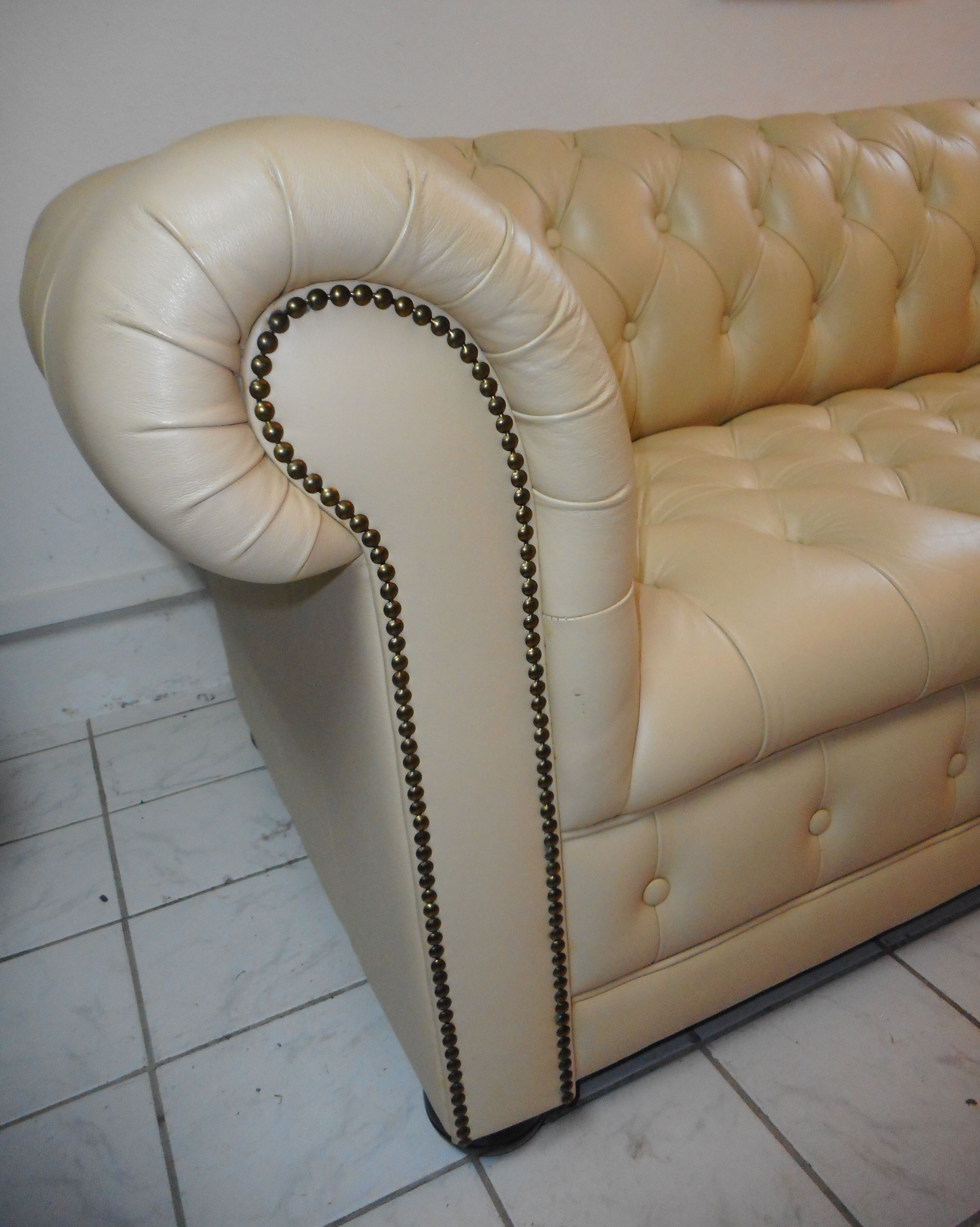 Beige leather chesterfield sofa