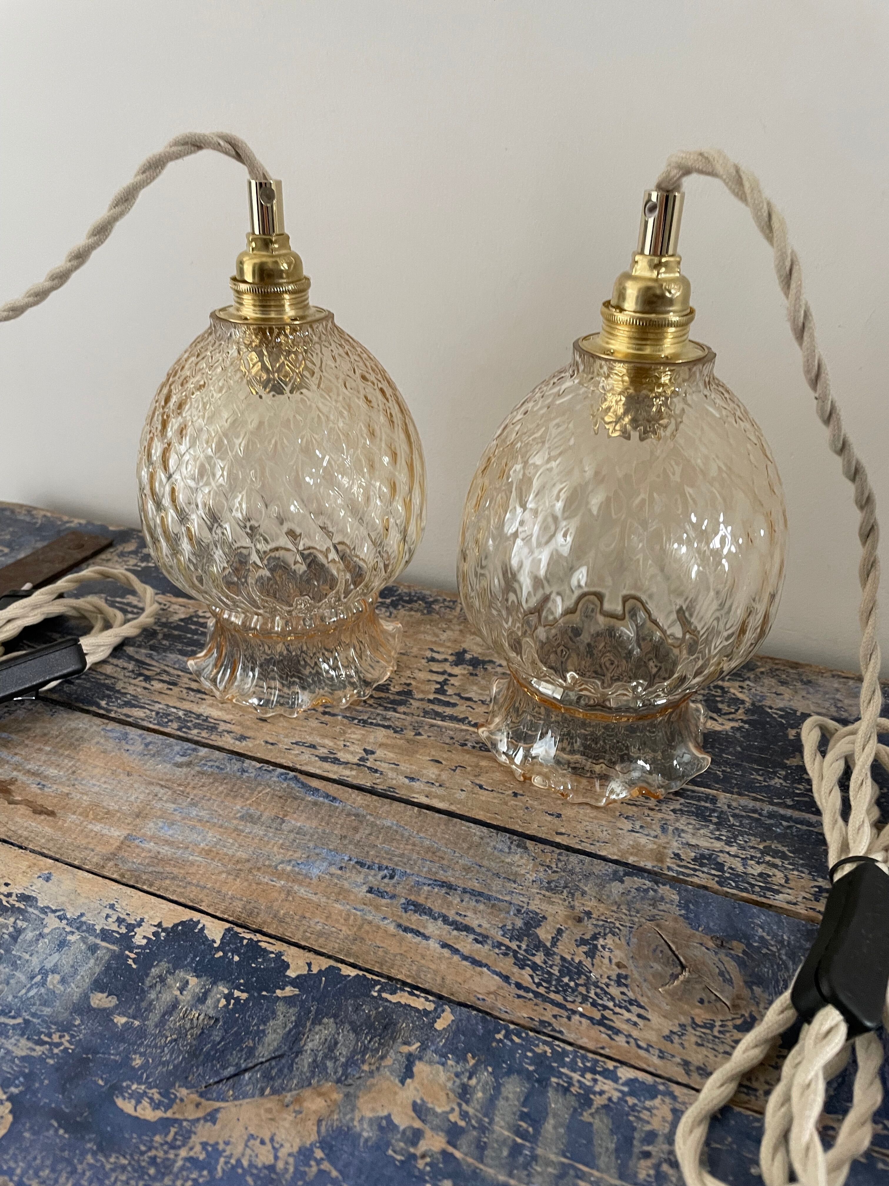 Set of two vintage golden glass handhelds