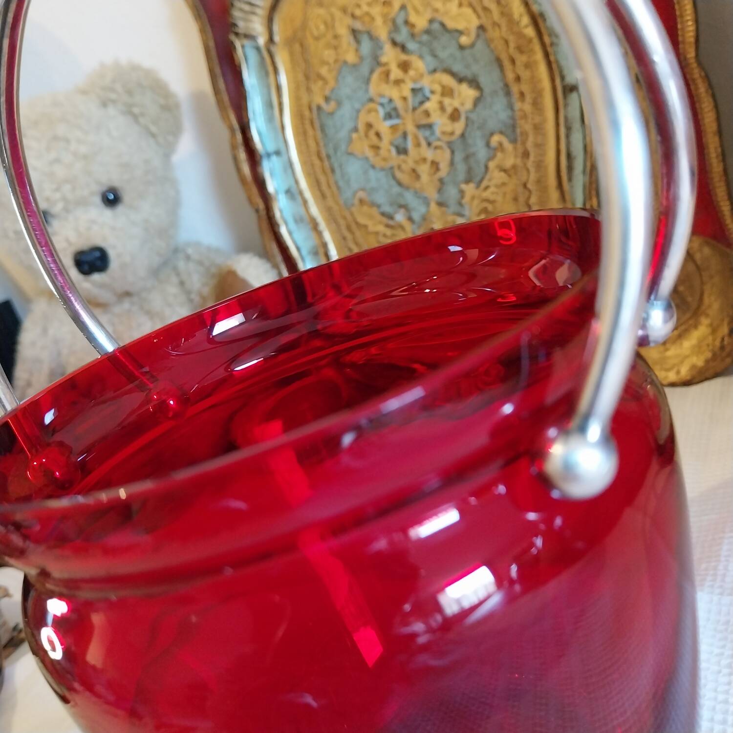 Vintage crystal ice bucket with silver-plated handle.