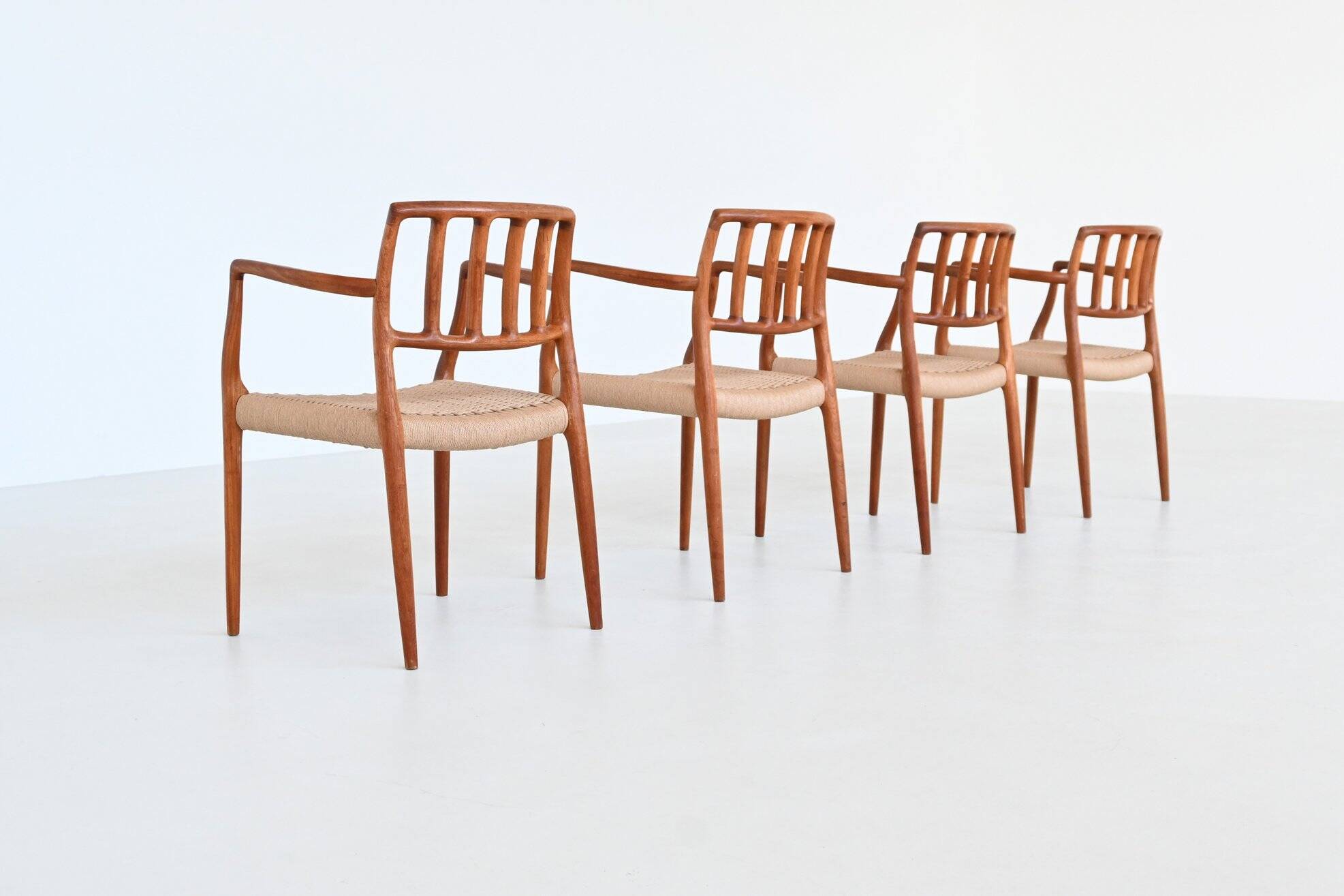 Niels Otto Moller model 66 armchairs teak and paper cord Denmark 1974