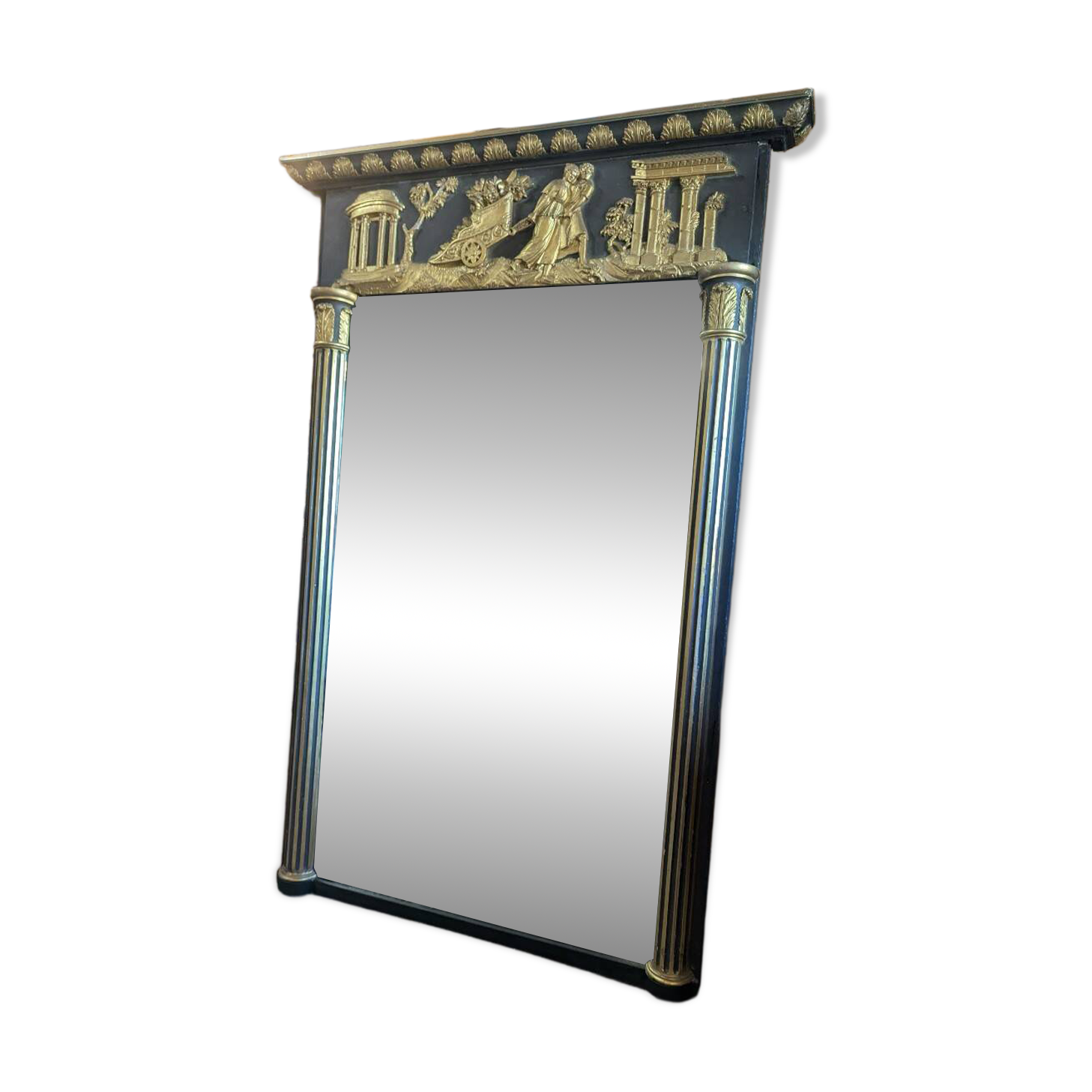 Large Empire-style mirror in dark green painted wood and gilded stucco.