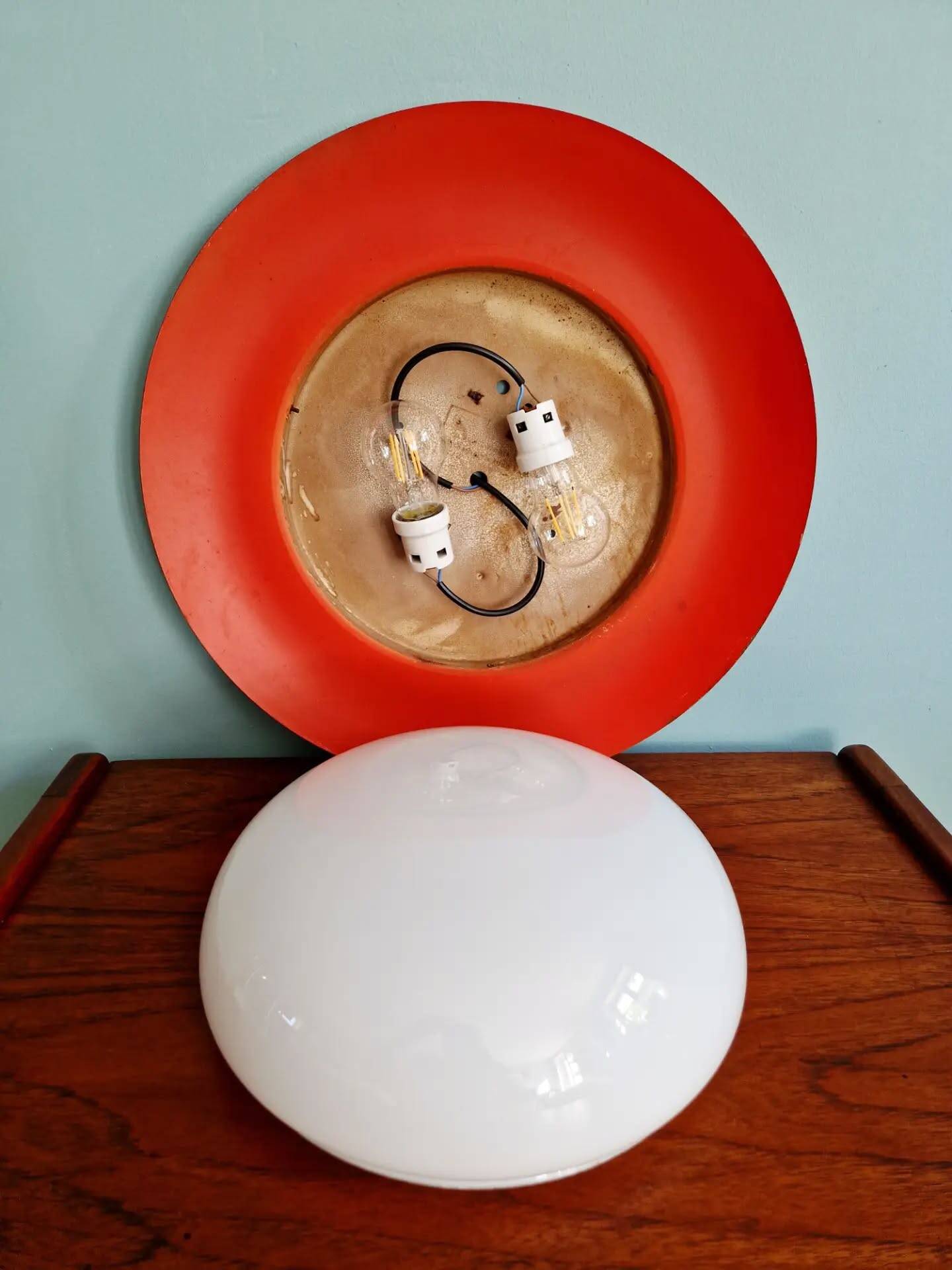 Pair of XXL Space Age wall sconces, orange lacquered metal and opaline, 1960.