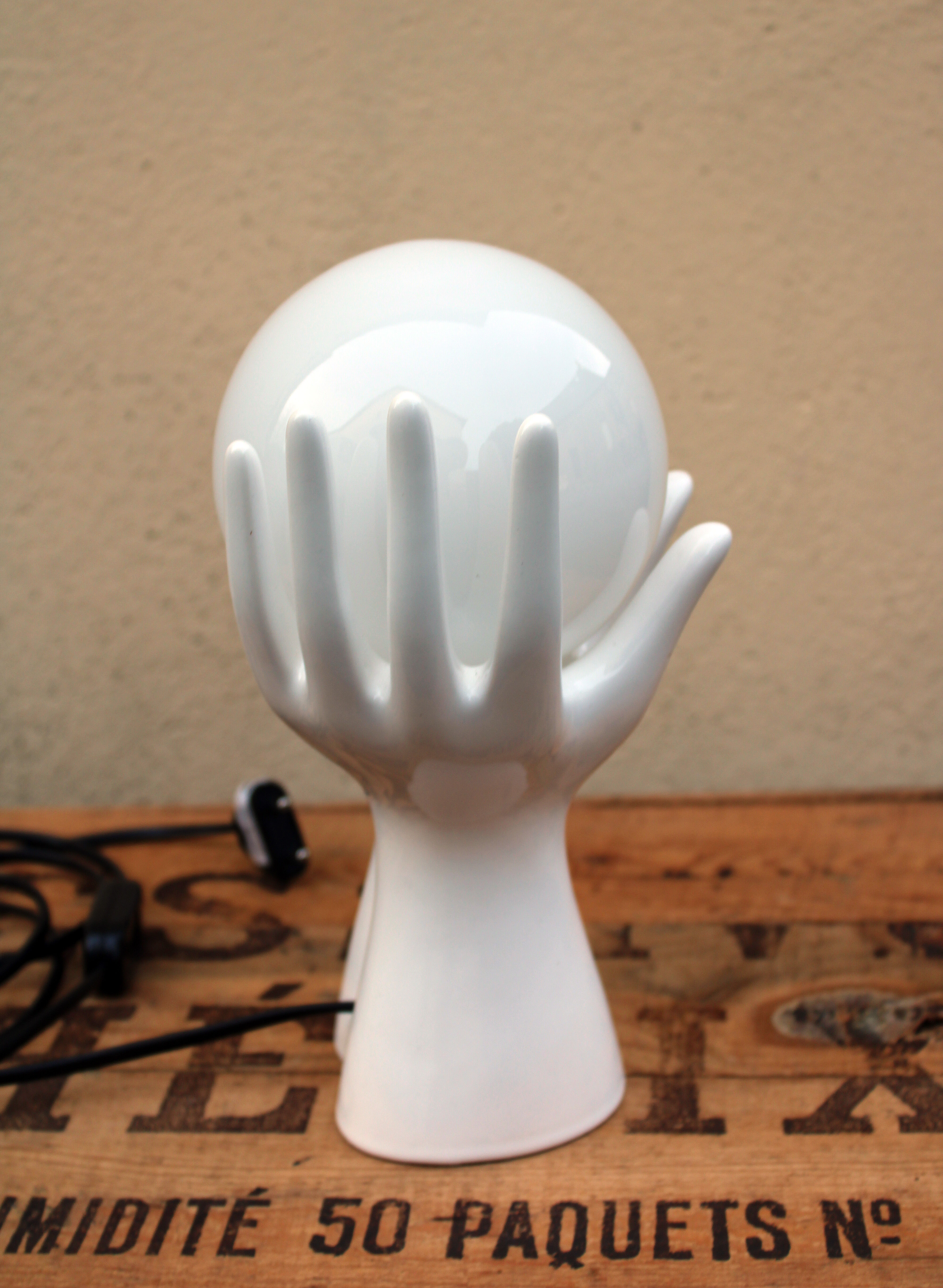 Hand-shaped lamp and opaline globe