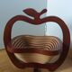 Foldable fruit basket in the shape of an apple.