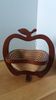 Foldable fruit basket in the shape of an apple.