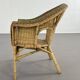 Cabriolet style armchair in rattan, wicker and green and red edging