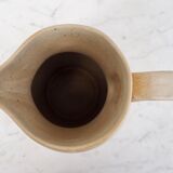 Beige ceramic pitcher