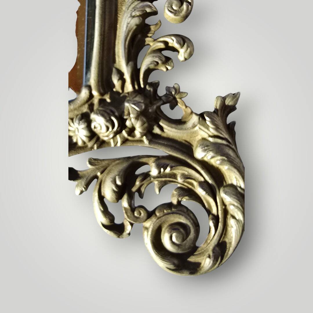 Gilded bronze wall mirror, beveled glass