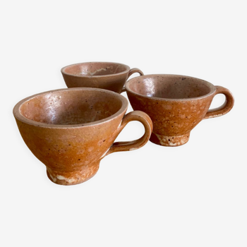 Three antique stoneware cups