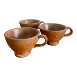 Three antique stoneware cups