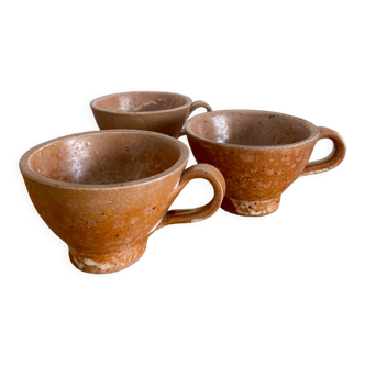 Three antique stoneware cups