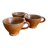 Three antique stoneware cups