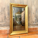 Antique gilded mirror from the Directoire period, 19th century.