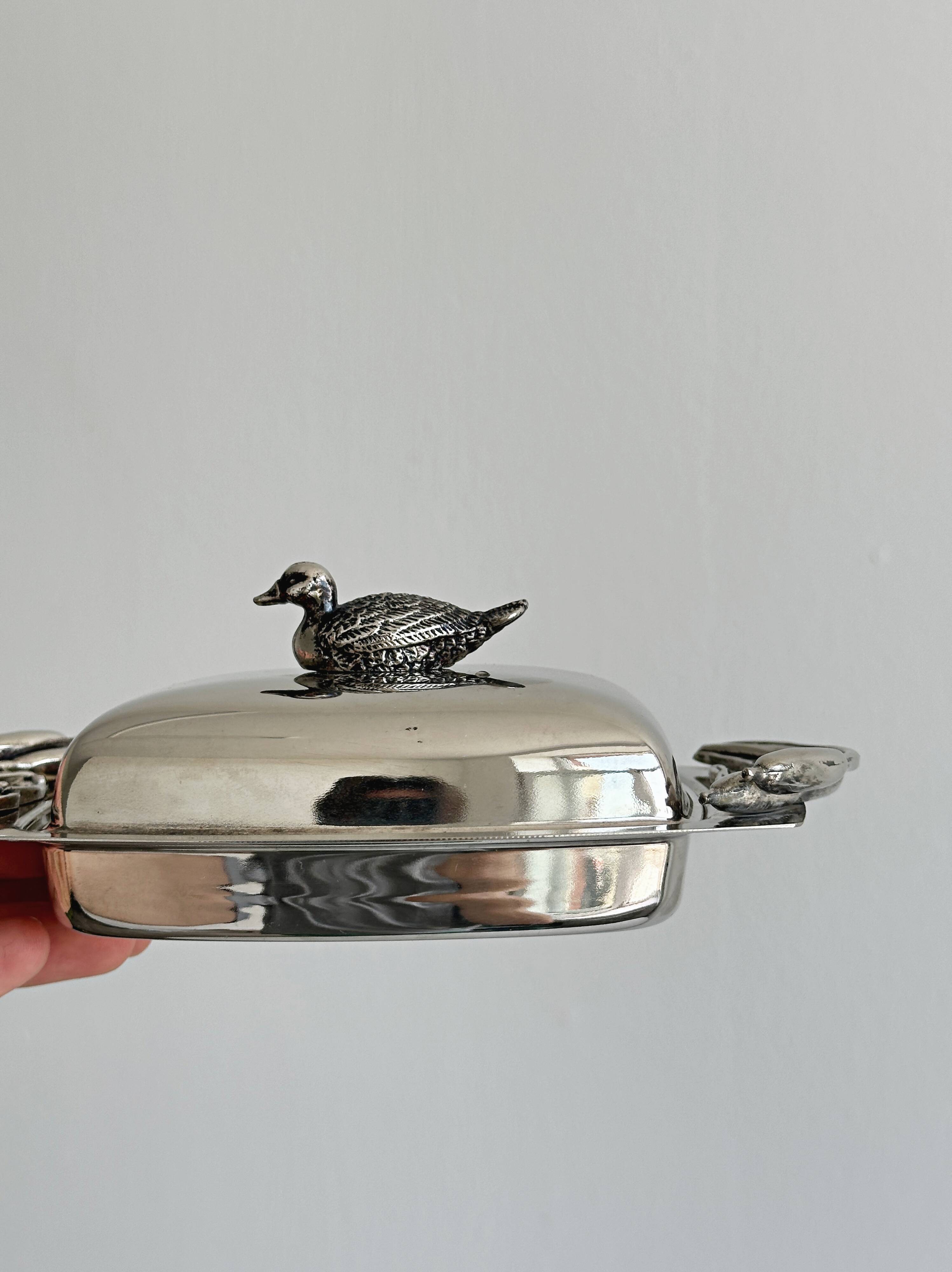 Antique shiny metal butter dish