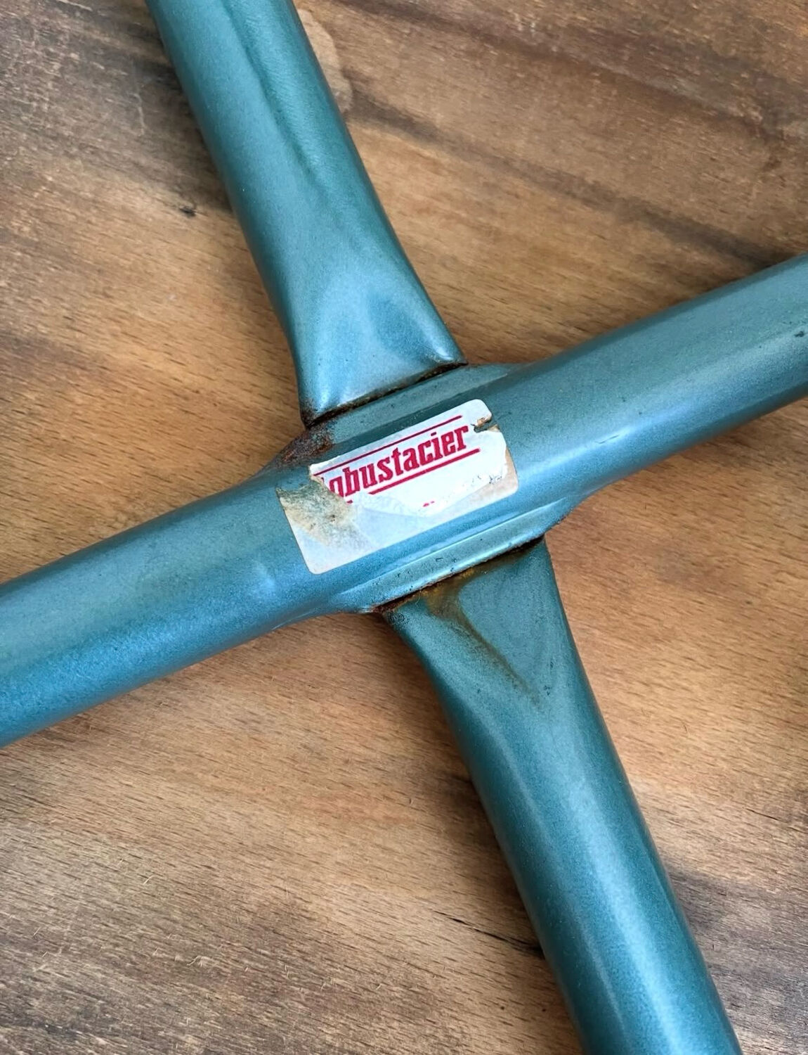 Wooden stool with metal tubes