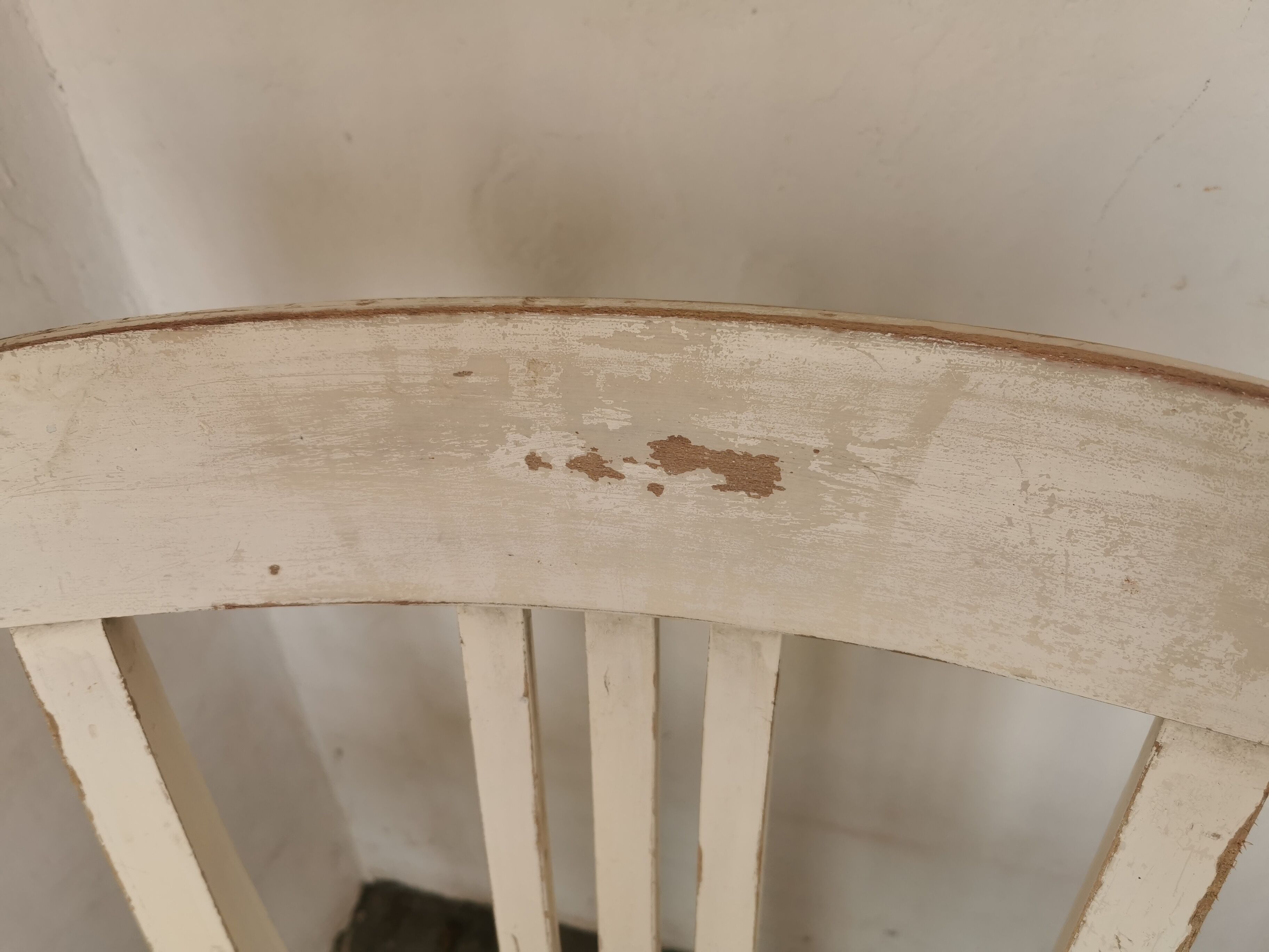 Set of 6 mismatched white chairs