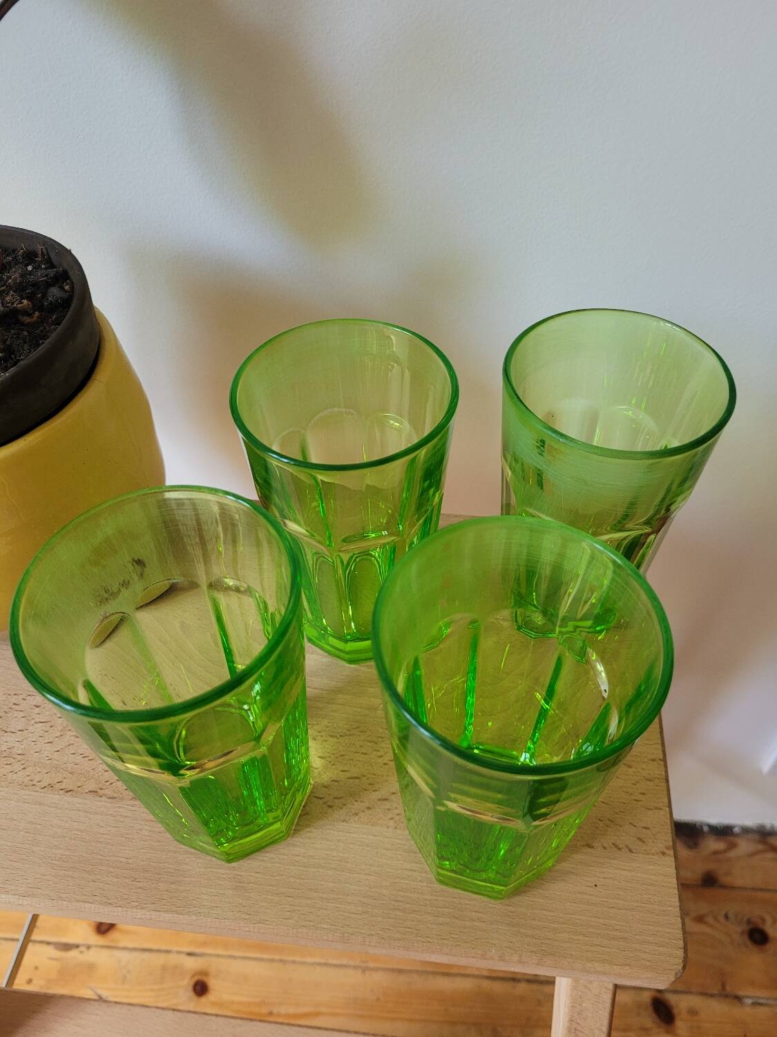 Four neon green lemonade glasses