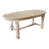 Oval table with integrated extension