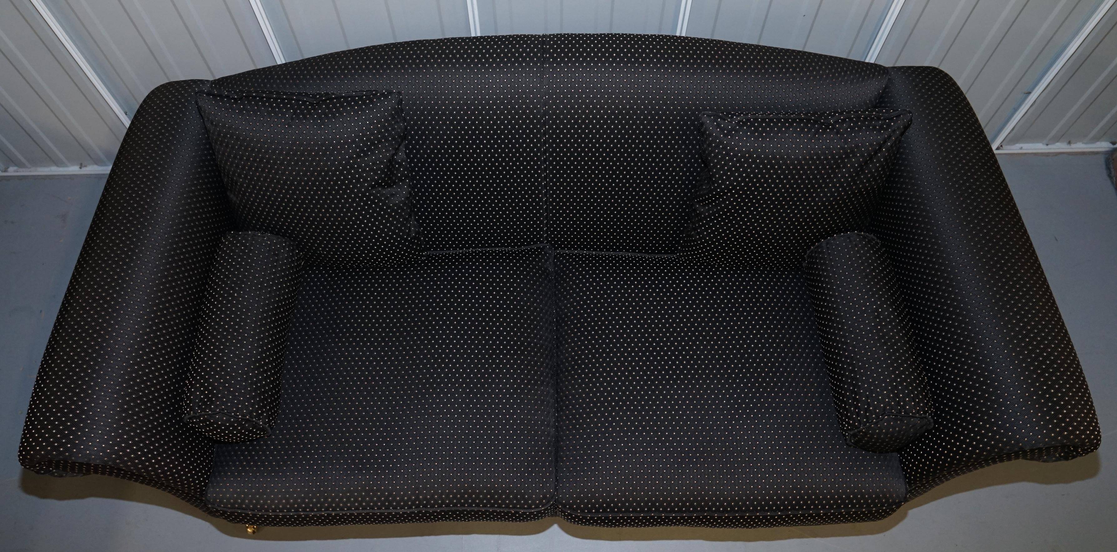 Three-seater Art Deco canapé with a light hardwood frame.
