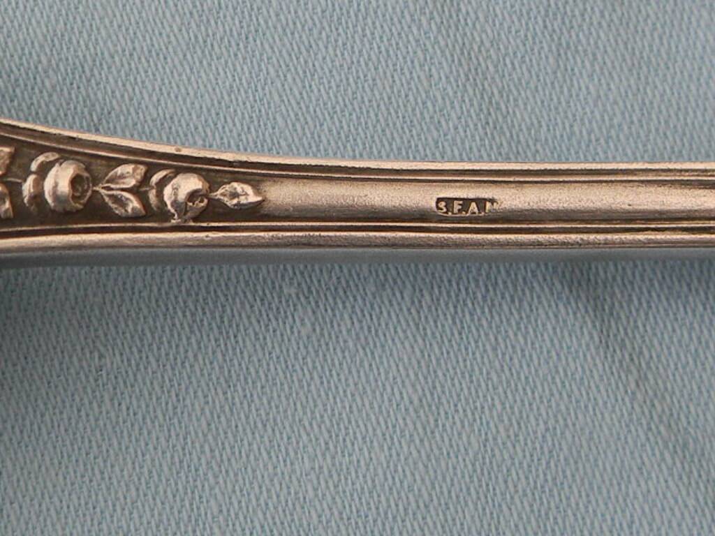 SFAM silver metal salad servers.