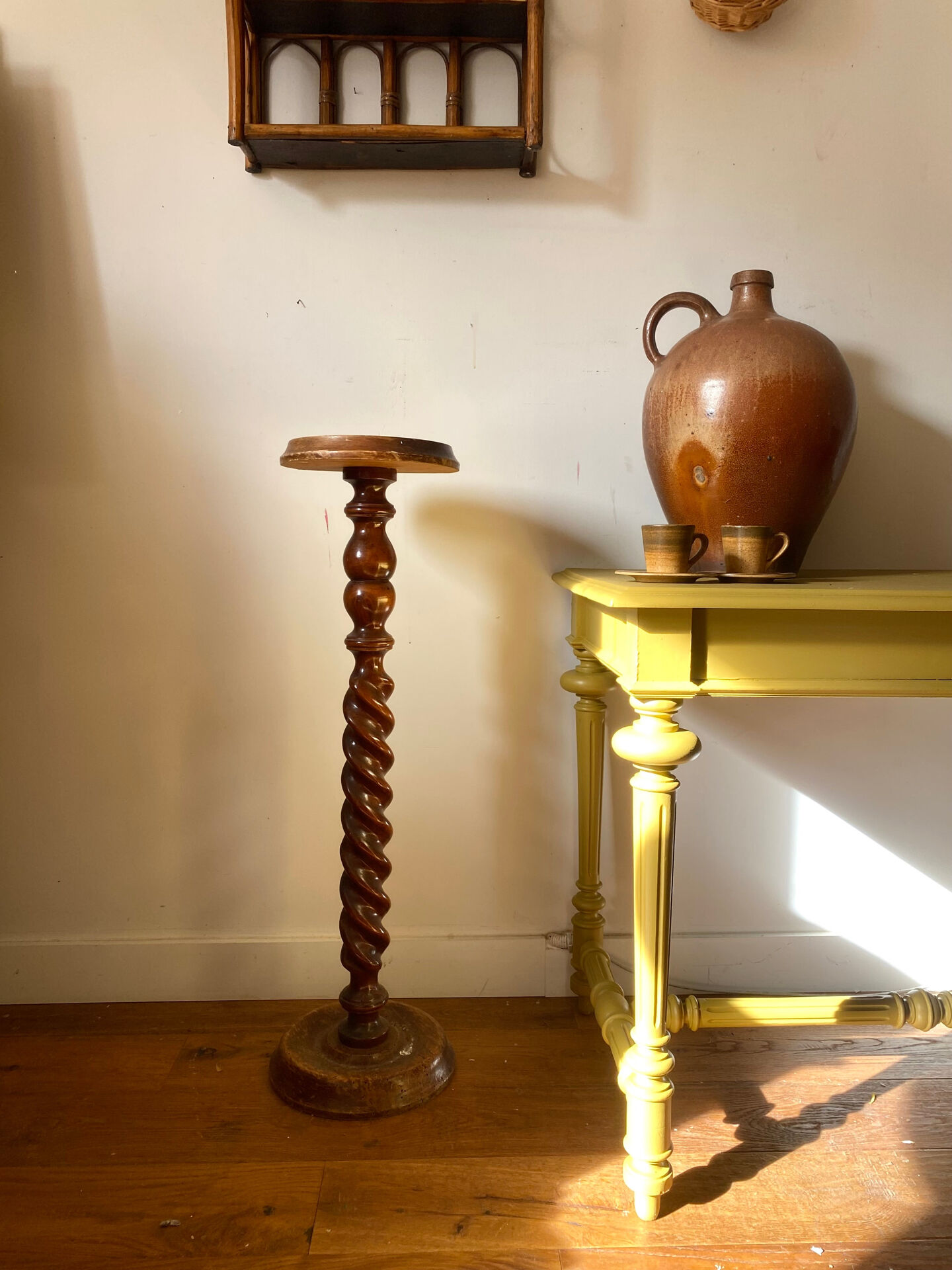 Antique pedestal table with a twisted column.