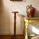 Antique pedestal table with a twisted column.
