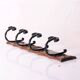 wood and wrought iron coat racks, set of two