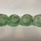 Four green glass paste candle holders
