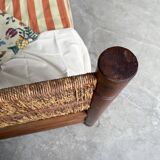 Brutalist style bed with chain and straw