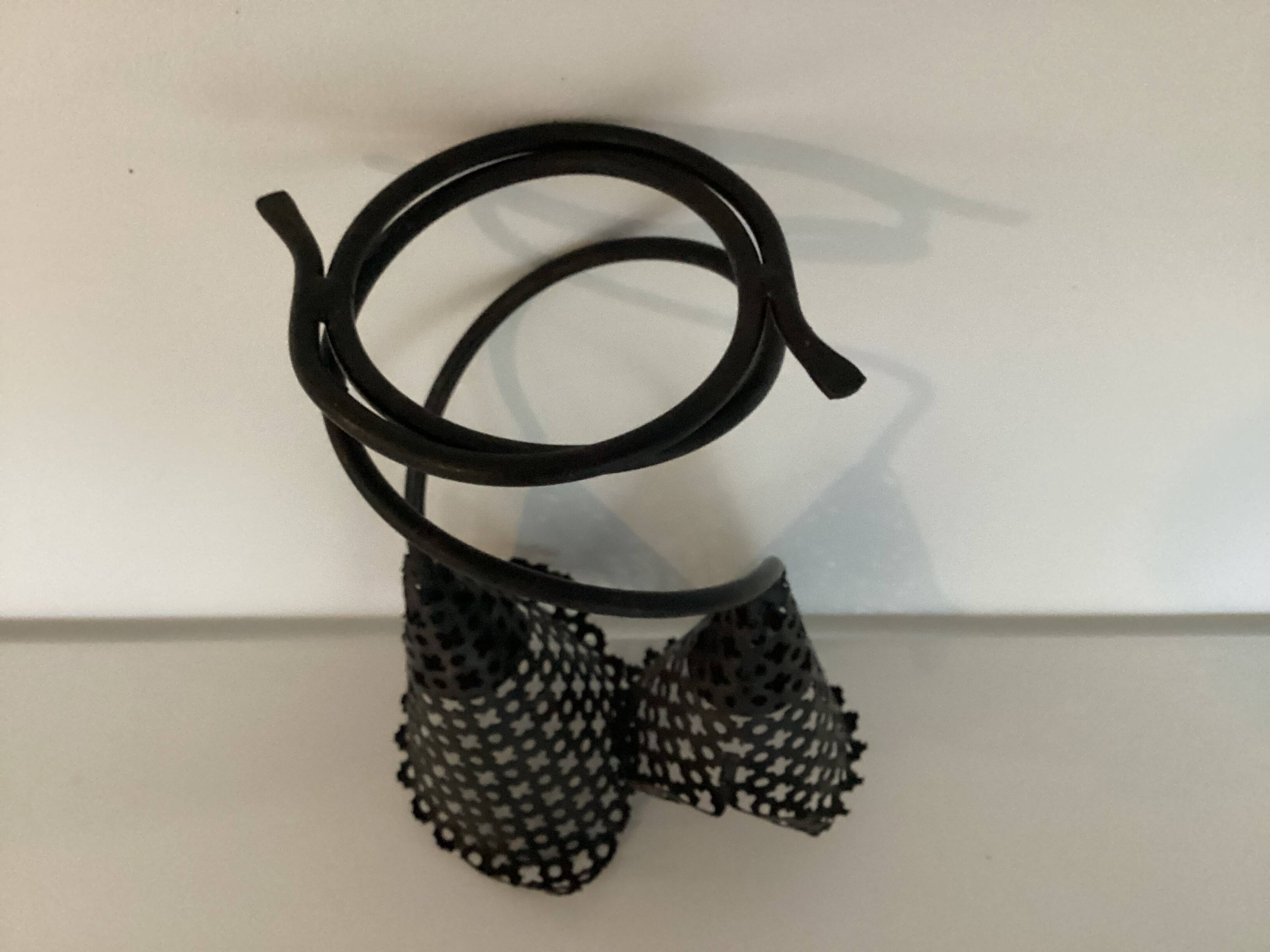 Perforated metal candle holder