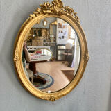 Miroir oval en bois doré 70x49cm