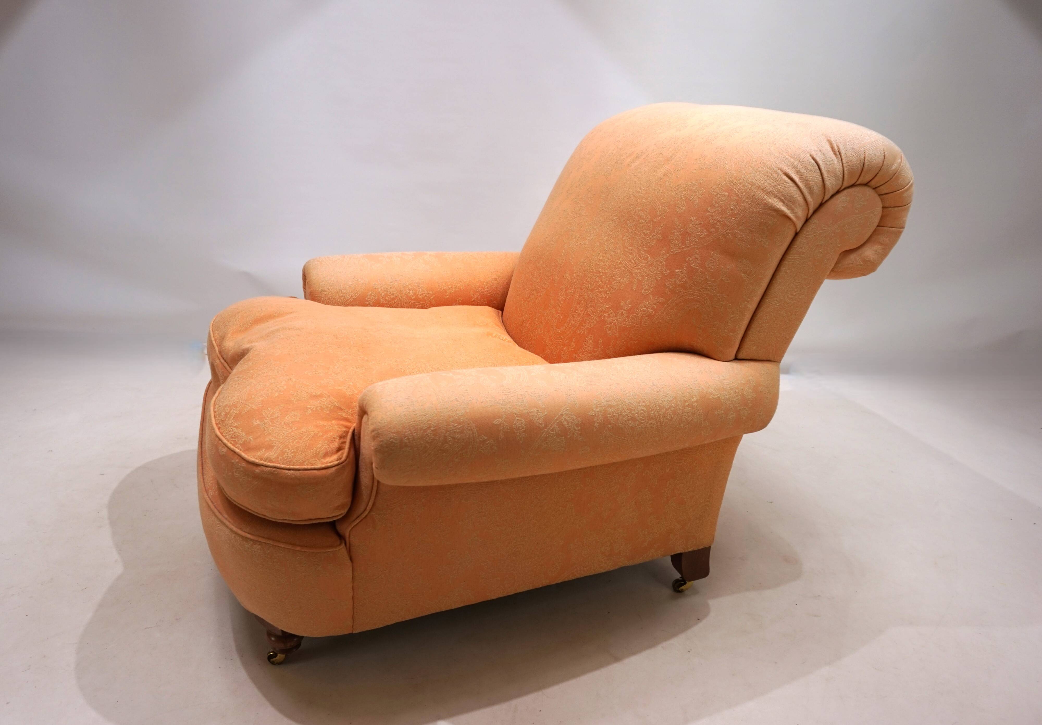 Deep seated armchair in the style of Howard & Sons